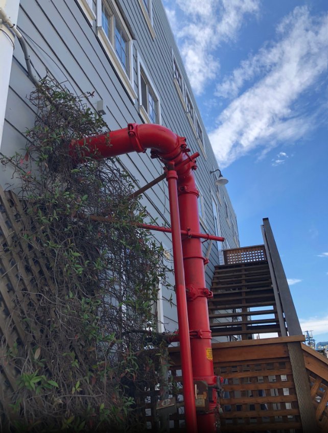 Industrial Detail — Red Pipe